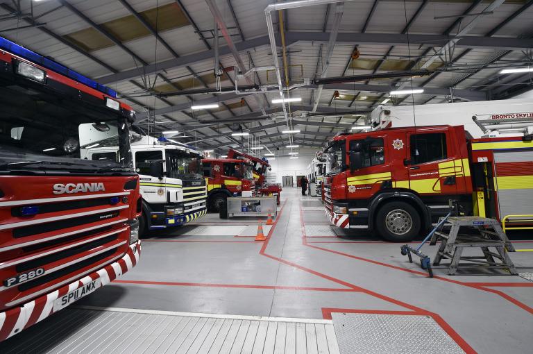 Three fire appliances inside Scottish Fire & Rescue Service's Dundee Asset Resource Centre. 
