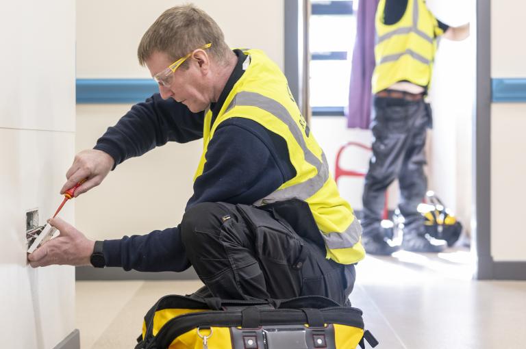 Robertson Facilities Management operatives performing hard FM maintenance in a local authority facility