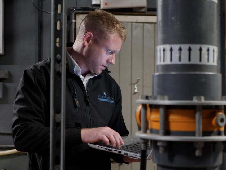 Facilities management worker assessing energy efficiency