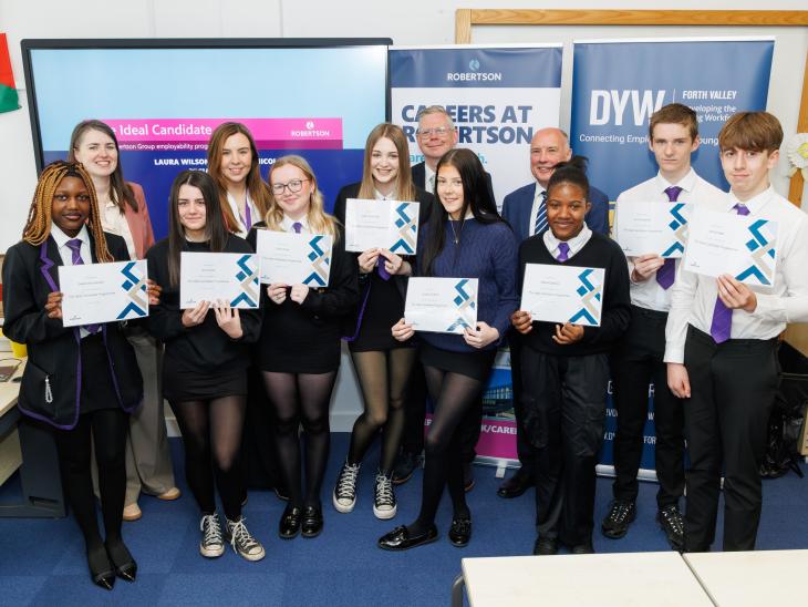 Wallace High pupils with certificates, following social value activity