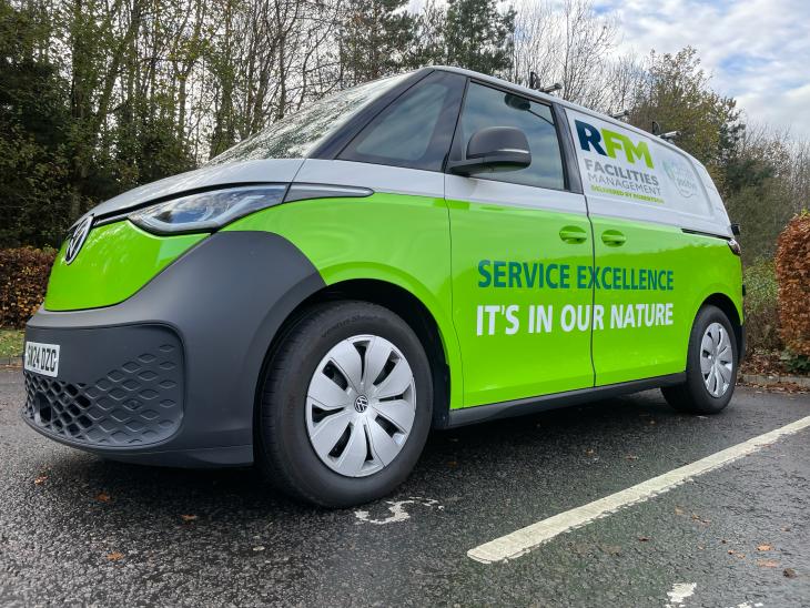 VW electric van with green branding and RFM Facilities Management - Service Excellence It's In Our Nature