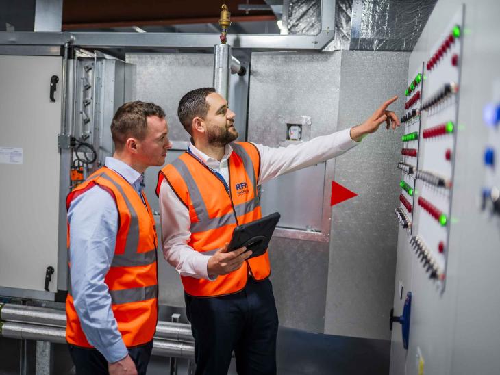 Facilities managers reviewing energy systems