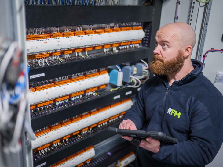 Hard FM engineer monitoring electrical systems