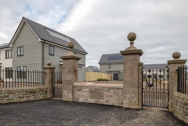 Social housing in Portsoy, Aberdeenshire, Scotland with historic wall from previous hospital site