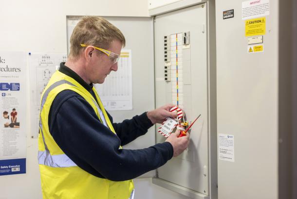 Robertson Facilities Management operative performing hard FM electrical maintenance at a local authority facility
