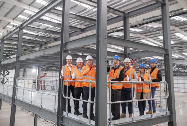 Sustainable packaging technology company Pulpex and main contractor Robertson Construction Central West have marked a major milestone on the construction of a new 87,000 sqft manufacturing facility near Glasgow Airport.