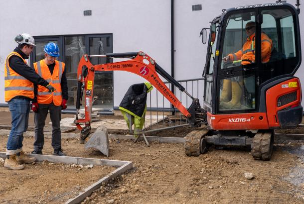 Image shows Robertson site manager Kieran Pemberton (far left), and Damien Lee (far right) from Hewitson Limited with Jack Grainger (middle), who completed a work placement at the Hebburn development with Robertson before securing a position with Hewitson as a trainee site manager.