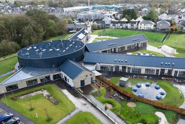 Aerial view of school with several wings