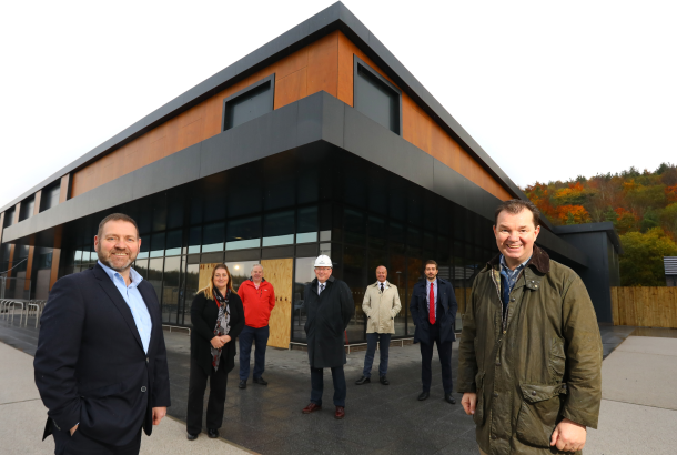 Completed Tyneveiw Retail Park with partners and stakeholders standing in front