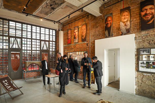 People standing inside gallery