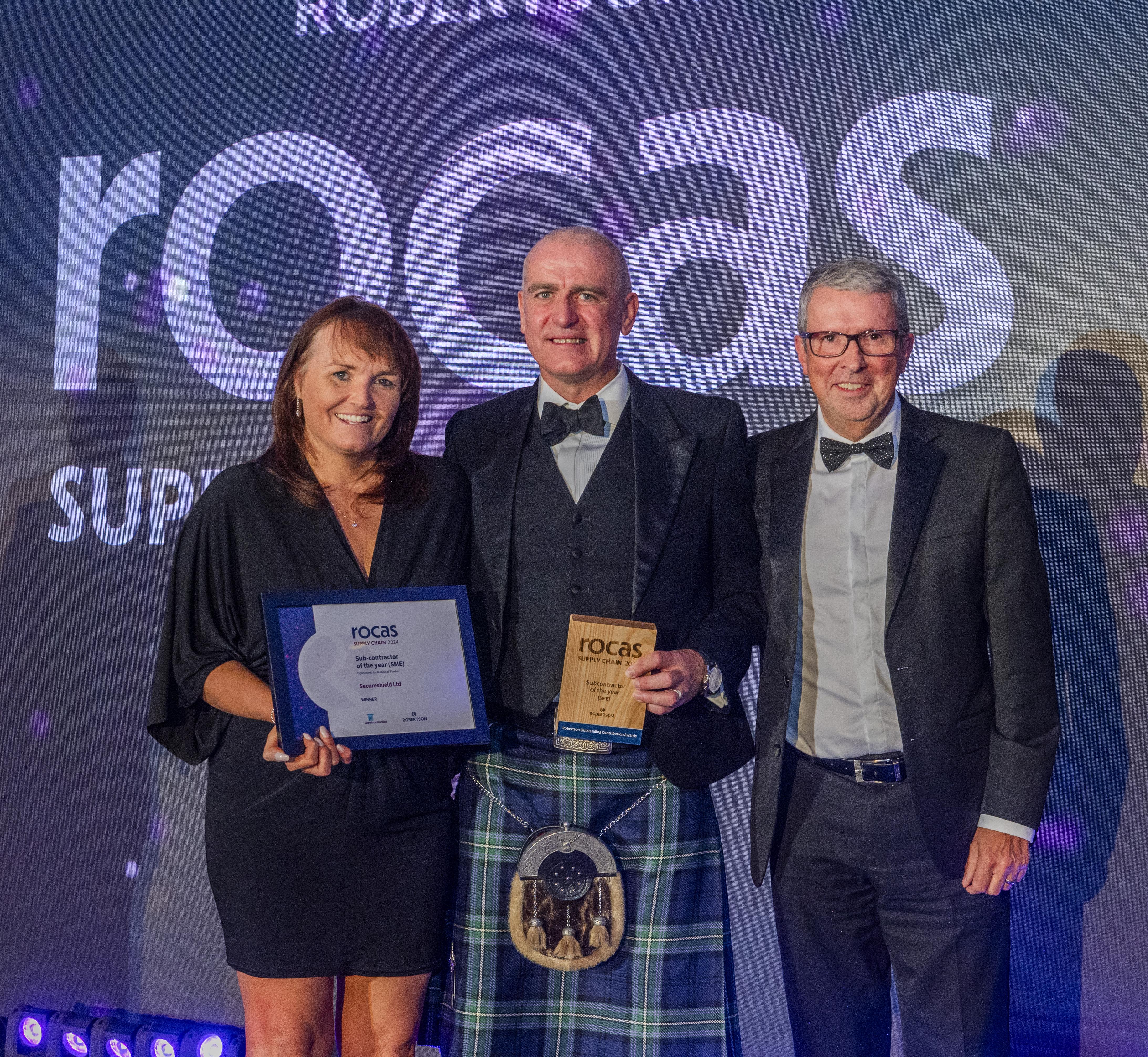 People holding awards from the Supply Chain Robertson Outstanding Contribution Awards