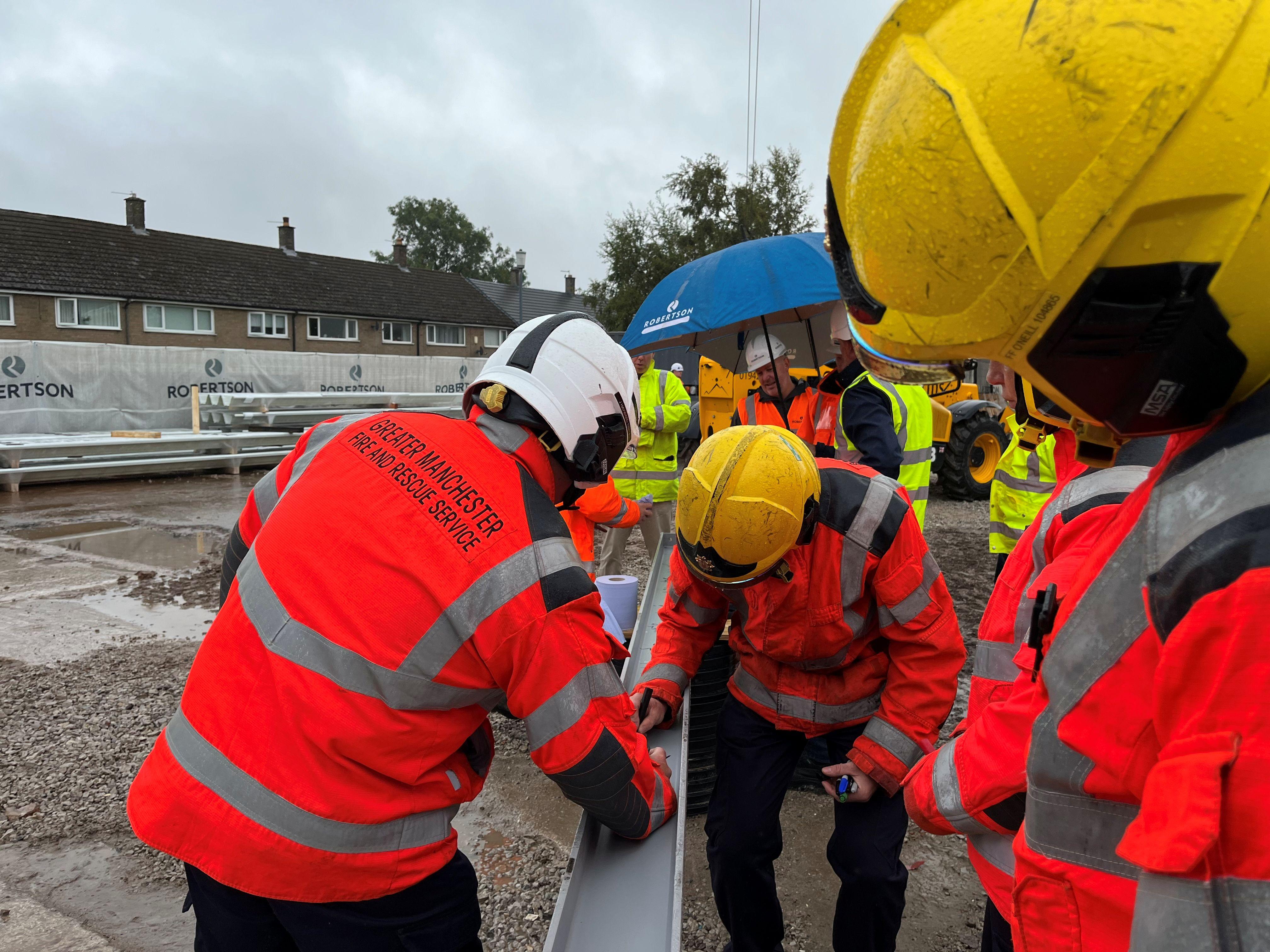 Whitefield Community Fire Station beam signing, hosted by Robertson Construction North West