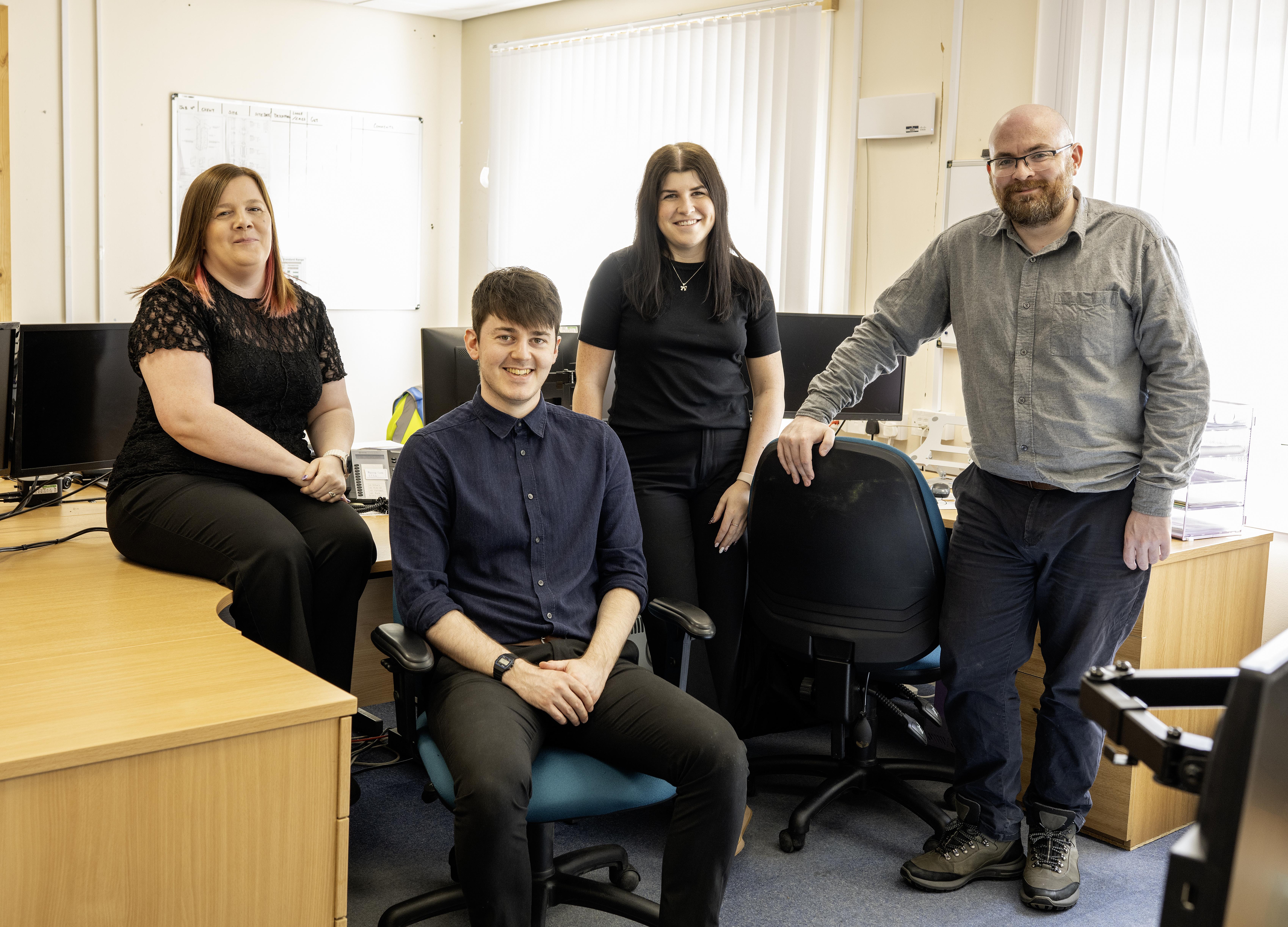 Group of timber frame design experts in an office
