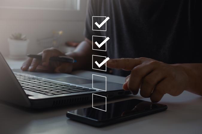 Person filling in survey on laptop