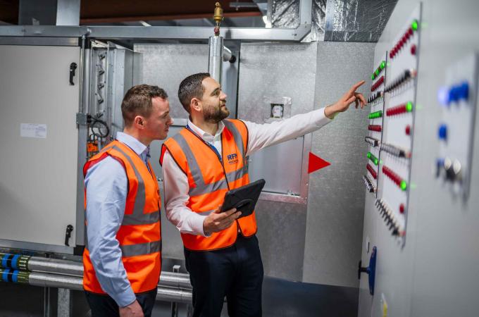 Facilities managers reviewing energy systems