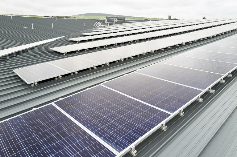 A row of solar panels fitted on the roof of The Balfour Hospital in Orkney.