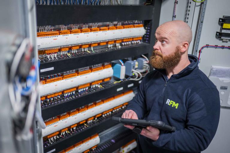 Hard FM engineer monitoring electrical systems