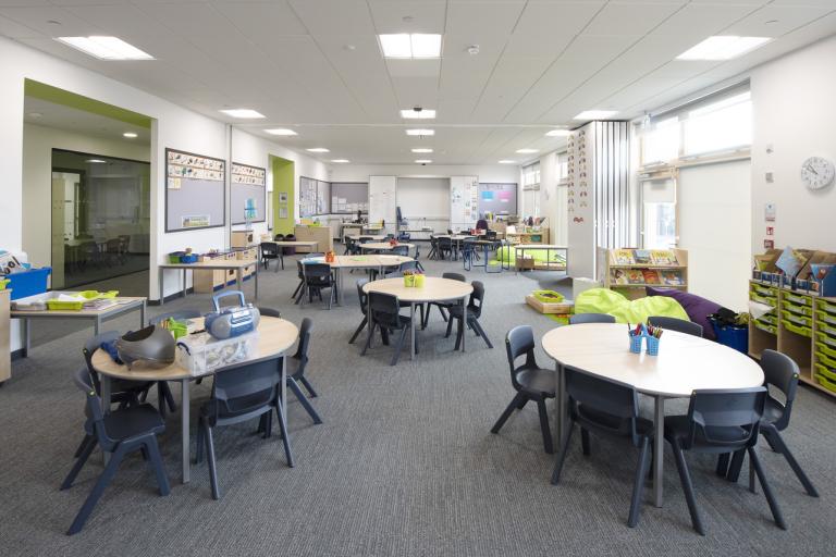 Classroom showing array of desks and chairs