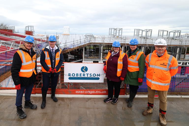 Robertson Construction North West representative with Flintshire County Council members and local teachers at Mynydd Isa Campus