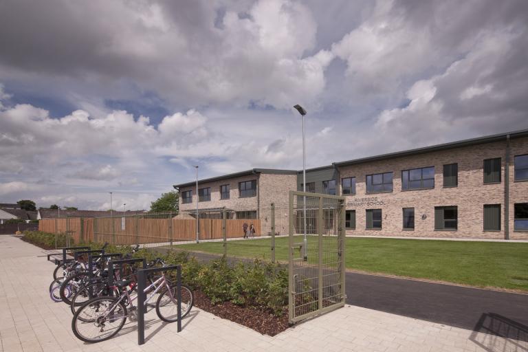 Bike racks and exterior of energy efficient Passivhaus school in Perth, Scotland