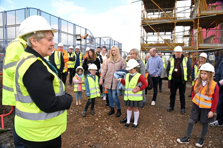 Pupils and their families at the Montgomerie Park Primary School Topping Out event listening to a presentation by Provost Anthea Dickson