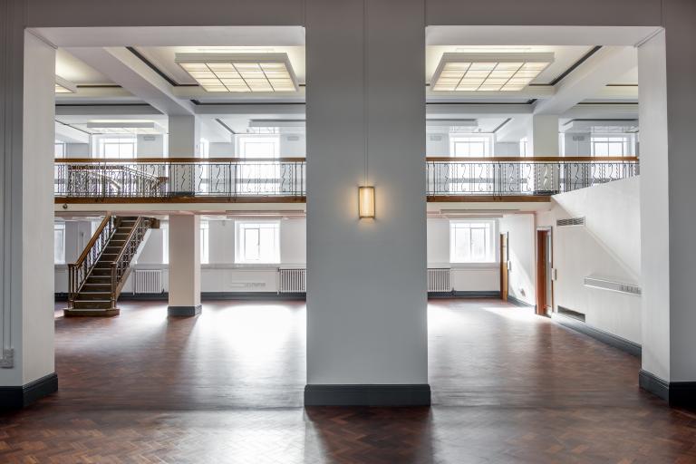 The clean and bright floor space and stairways in Bolton Central Library.