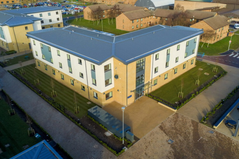 Aerial picture of accommodation building at RAF Lossiemouth with blue sky