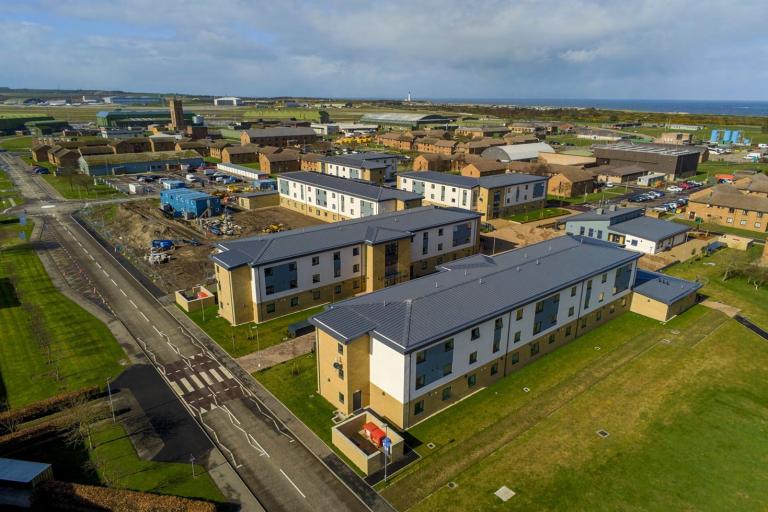 Aerial picture of accommodation building at RAF Lossiemouth with blue sky