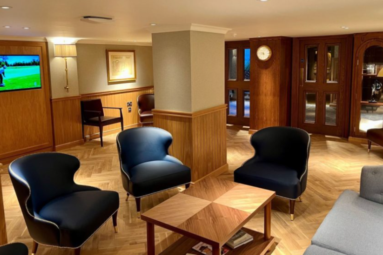 Room with chairs that displays golfing accolades