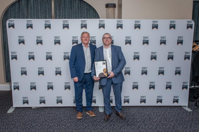 People from Robertson Group holding certificates from the CCS National Site Awards