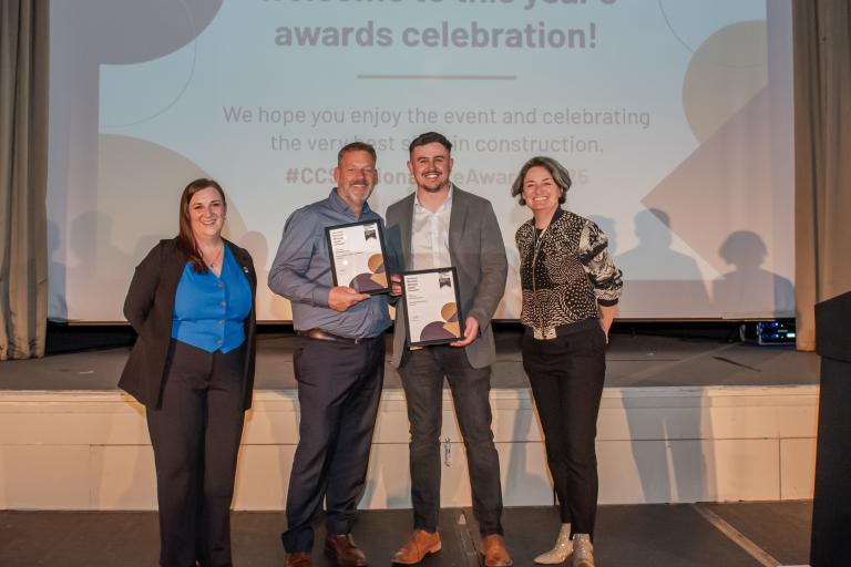 People from Robertson Group holding certificates from the CCS National Site Awards