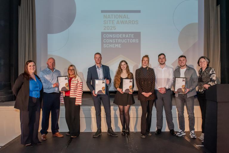 People from Robertson Group holding certificates from the CCS National Site Awards