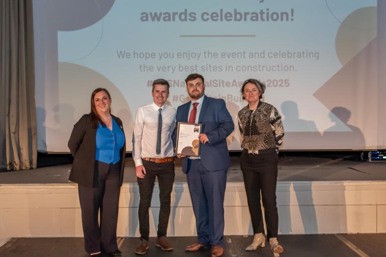 People from Robertson Group holding certificates from the CCS National Site Awards