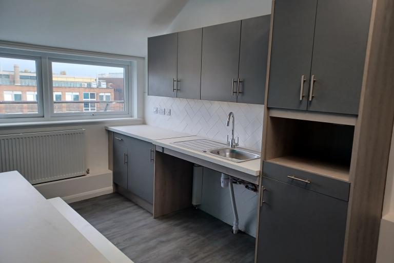 Kitchen areas with sink and cupboards