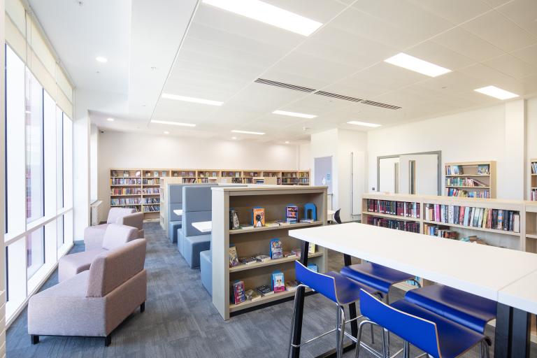 Library area with desks and sofas