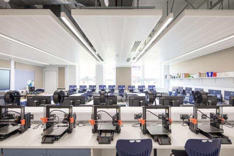 Classroom with desks and 3D printers