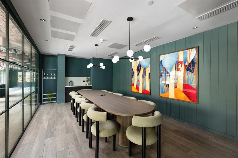 Meeting room featuring contemporary funrniture at The McEwan BTR development, delivered by Robertson Construction Central East