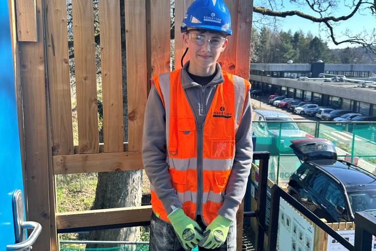 Young person on work experience on a construction site