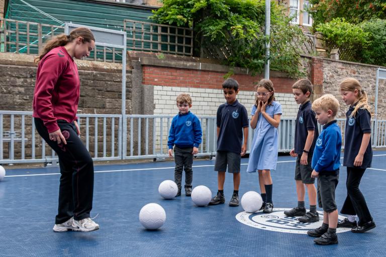 Hearts FC Midfielder Olivia Chomczuk playing with Edinburgh pupils