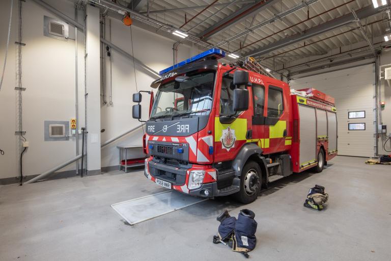 Fire station interior with fire engine