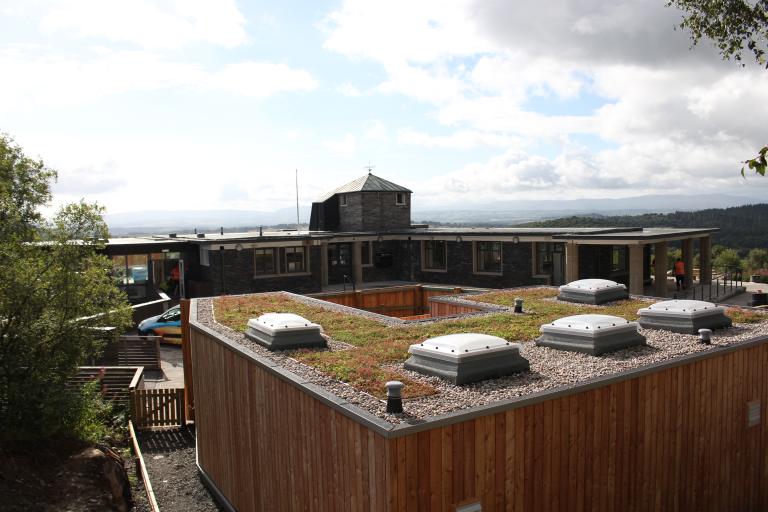 The timber-clad external toilet block