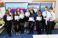 School pupils holding certificates from Robertson Group's Ideal Candidate Programme