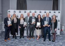 People from Robertson Group holding certificates from the CCS National Site Awards