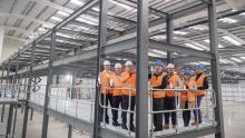 Sustainable packaging technology company Pulpex and main contractor Robertson Construction Central West have marked a major milestone on the construction of a new 87,000 sqft manufacturing facility near Glasgow Airport.