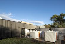 Exterior of advanced computing building with cooling plant