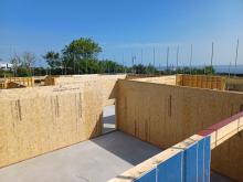 Commercial building under construction with prefabricated timber frame components
