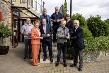 Sir Bill Robertson congratulates long serving employees