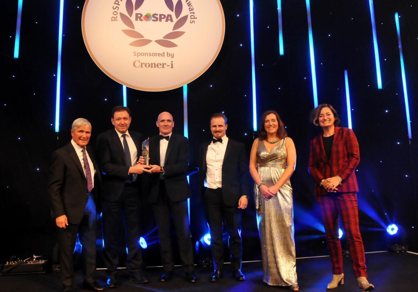 People standing at an award ceremony