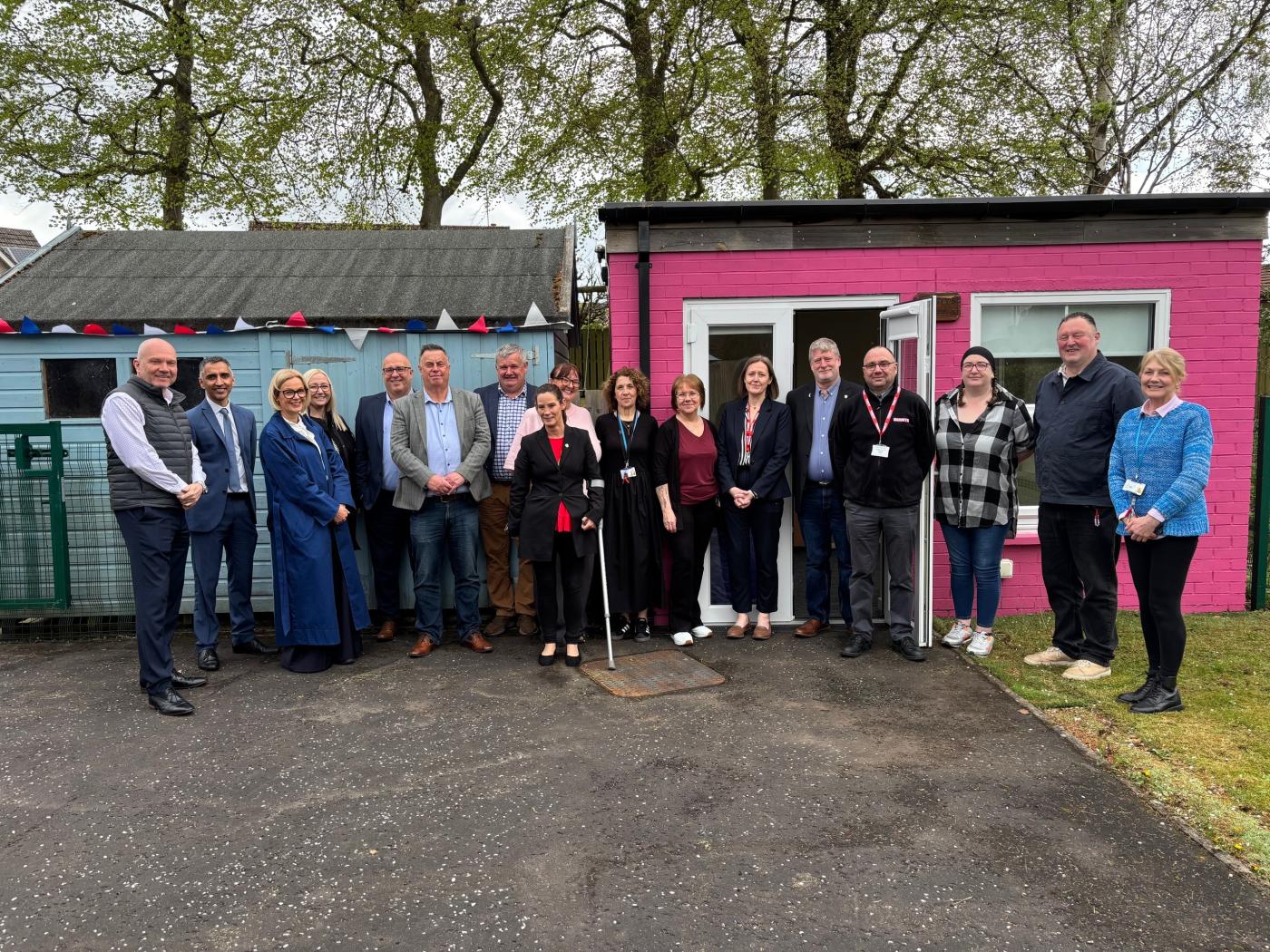 Robertson and Perth & Kinross Council standing outside at Woodlea Cottage's new sensory area