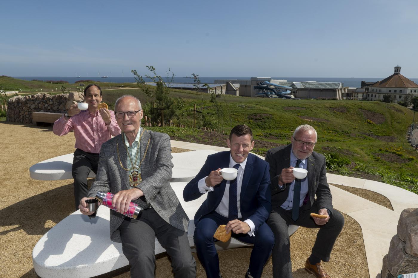 People in Aberdeen toasting a cup of tea to the opening of Broadhill, part of the Aberdeen Beacfront Masterplan that Robertson Group is delivering